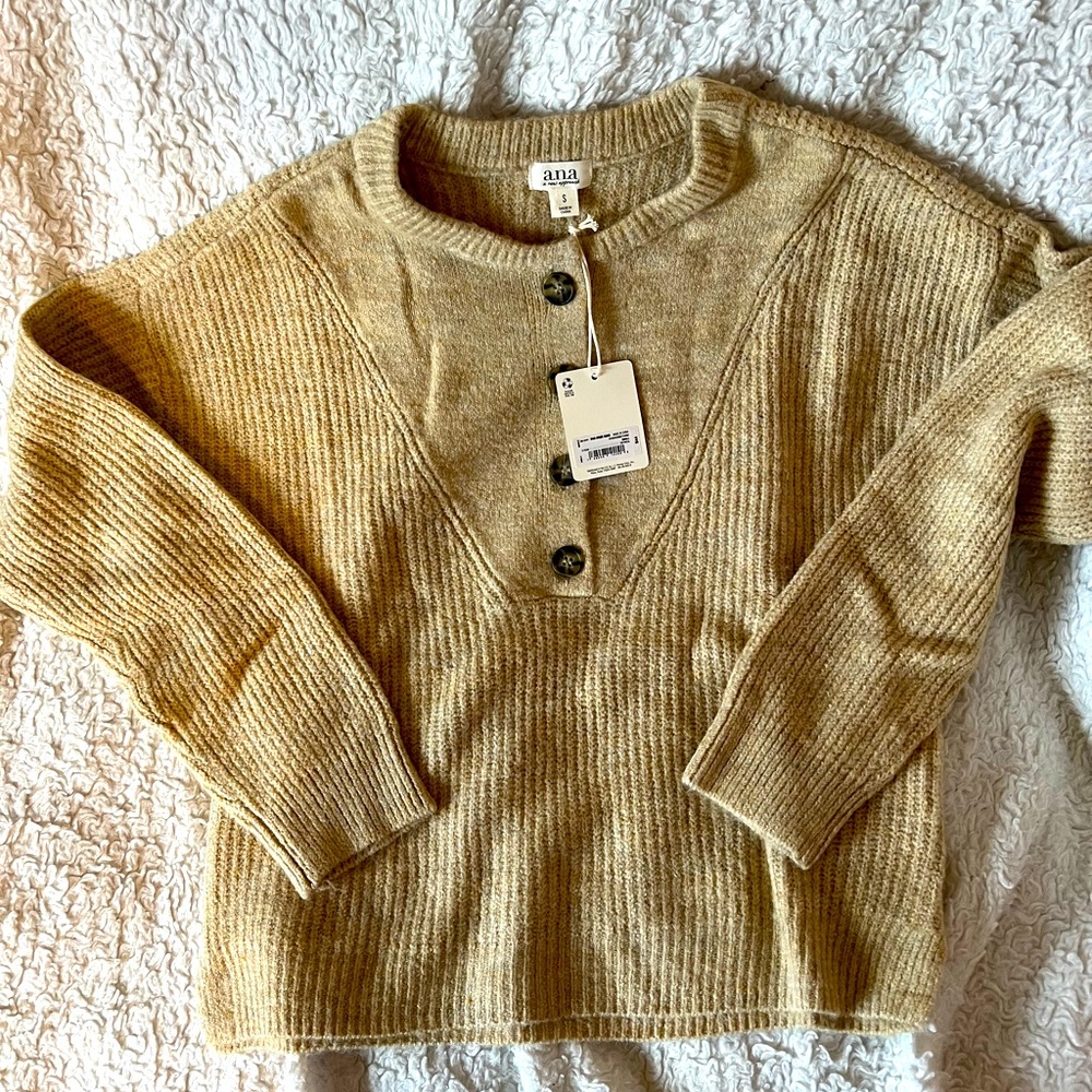 Brand new with tags women’s sweater with cute buttons!